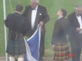 Gordon Wilson about to hoist the Centenary flag