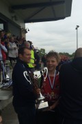 U14 captain Ruaridh McCall receives the trophy