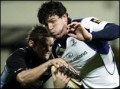 Shane Horgan is halted by Max Evans at Firhill 